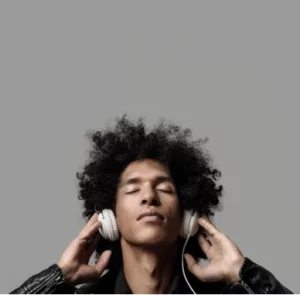 MusicTeam Spotify 1 Man listening to headphones with eyes closed