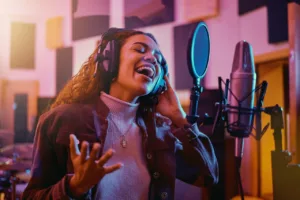 Woman-making-sound-recording-in-studio