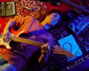 Guitarist-lying-on-carpet-singing